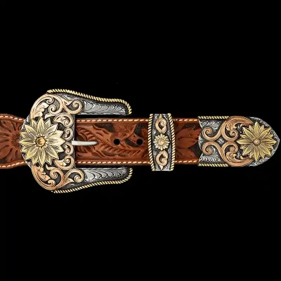 A custom western three piece belt buckle set featuring golden sunflower figures and copper scrollwork 